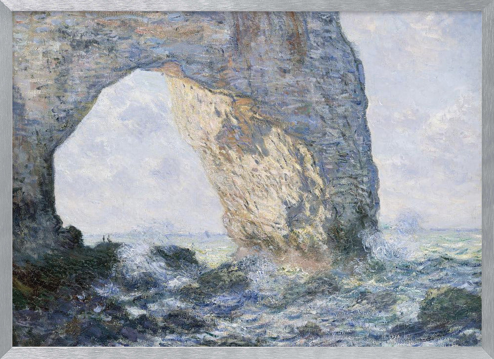 An impressionist painting by Claude Monet of the Manneporte rock arch at Étretat, France. Sunlight illuminates the massive stone arch as turbulent blue and white waves crash against the rocky shoreline below. The artwork is displayed in a silver frame. Decor