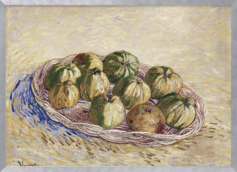A post-impressionist still life painting by Vincent van Gogh showing a woven basket full of green and yellow apples. The background is a textured pale yellow, and the artist's signature is visible in the bottom left. The artwork is presented in a silver frame. Poster