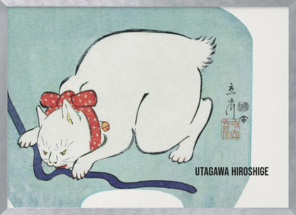 A Japanese woodblock print by Utagawa Hiroshige featuring a white cat with a fierce expression. The cat is wearing a red polka-dot collar with a large bow and a small bell, playfully biting a dark blue cord against a light blue background. Wall Art