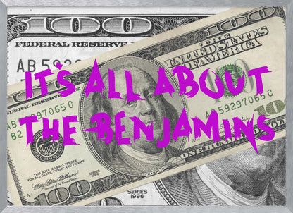 A pop art piece featuring a close-up of a one-hundred-dollar bill. The phrase 'IT'S ALL ABOUT THE BENJAMINS' is written across the image in a messy, graffiti-style font in a vibrant magenta color. The artwork is set within a silver frame. Wall Art