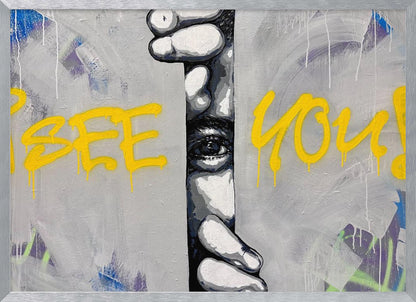 A framed modern art piece depicting a black and white eye peeking through a narrow vertical opening, with hands gripping the sides. The background is a textured gray with vibrant yellow graffiti-style text that reads 'I SEE YOU!' with paint drips. Print