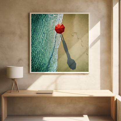 An aerial photograph of a serene beach scene, featuring a vibrant red umbrella on the golden sand next to the clear turquoise ocean. Gentle white waves lap the shore, and a long shadow from the umbrella stretches across the sand, where a trail of footprints leads away. Poster