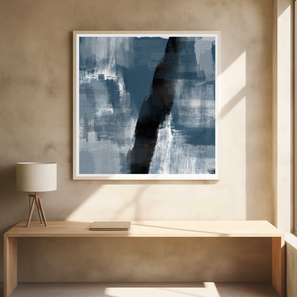 Abstract painting with bold blue, grey, and black brushstrokes in a light wood frame.