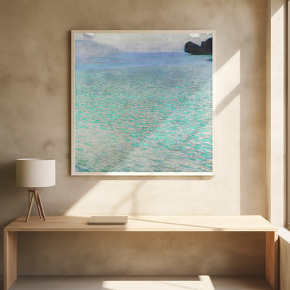 An impressionist painting by Gustav Klimt, in a light wood frame, depicting a serene body of water. The surface shimmers with countless dabs of bright turquoise and light blue paint, creating a textured, sparkling effect. In the distance, a hazy shoreline sits under a muted, overcast sky. Decor