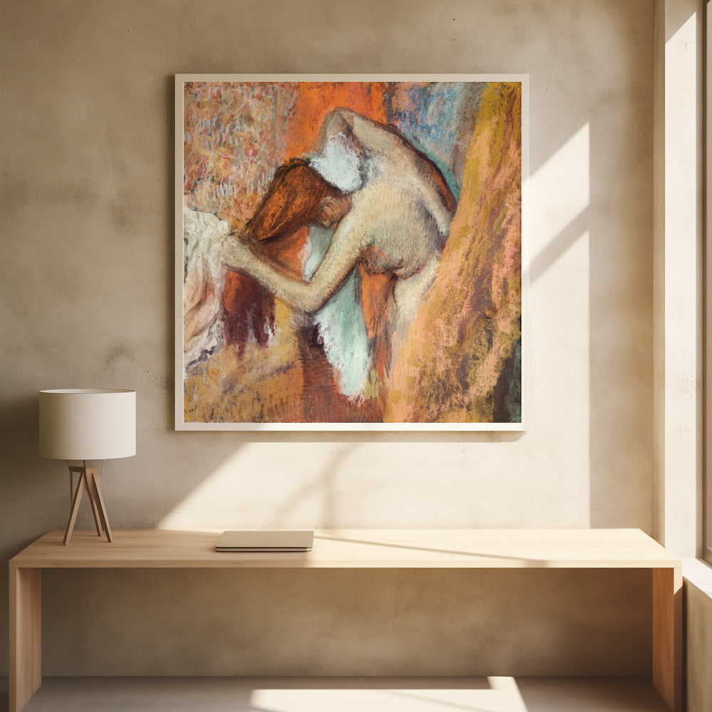 A framed impressionist pastel drawing by Edgar Degas showing a nude woman from the back, bending over to dry her neck with a towel. The artwork is characterized by its warm color palette of oranges, browns, and yellows, with textured, visible strokes. Decor