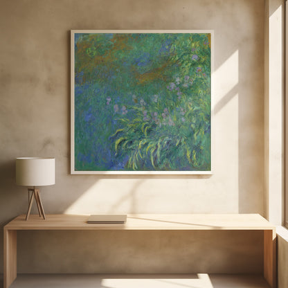An impressionist painting by Claude Monet, 'The Artist's Garden at Giverny,' featuring a dense patch of purple irises amidst a sea of green and blue foliage, rendered with textured brushstrokes and set in a light wood frame. Print