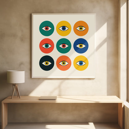 A framed modern art print featuring a 3x3 grid of nine colorful circles on an off-white background. Each circle, in shades of green, yellow, orange, red, and blue, contains a single stylized eye, creating a repeating pop art pattern. Wall Art