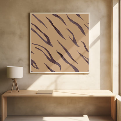 A framed piece of art featuring an abstract pattern of dark, purplish-brown tiger stripes painted in a watercolor style, arranged diagonally on a solid tan background, all enclosed within a light wood frame. Decor