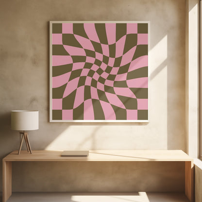 A framed abstract art piece featuring a warped checkerboard pattern in pink and dark olive brown. The grid appears to twist and distort, creating an optical illusion of movement within a light wood frame. Print