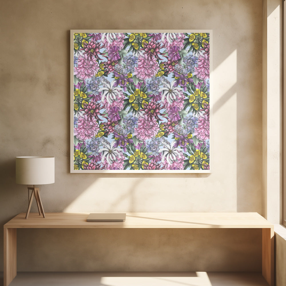 A framed artwork displaying a dense, repeating floral pattern with detailed illustrations of pink, purple, blue, white, and yellow flowers on a light blue background, encased in a simple light wood frame. Decor