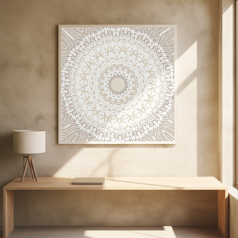 A framed square artwork featuring a detailed mandala design in neutral tones. The intricate pattern consists of concentric circles with geometric shapes like 'X's and chevrons, rendered in shades of beige and taupe on a white background, all enclosed in a light-colored wooden frame. Decor