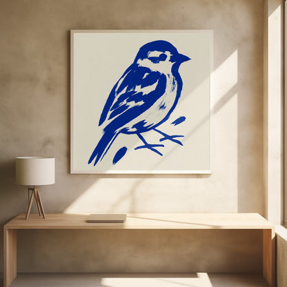 A stylized art print of a small bird, possibly a sparrow, rendered in bold cobalt blue ink with expressive brushstrokes. The bird is set against a solid cream background and enclosed in a light wood frame. Print