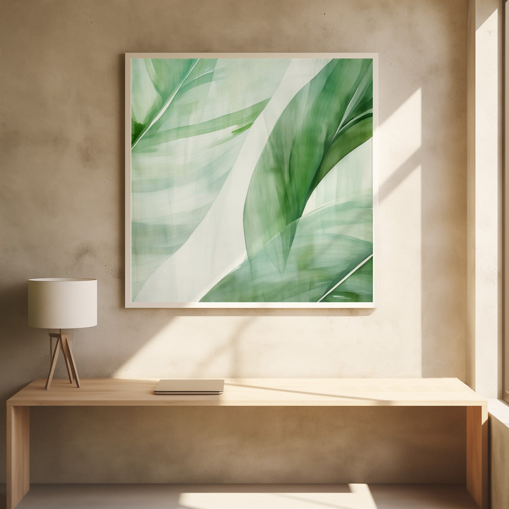 A light wood framed artwork depicting a close-up, abstract watercolor painting of large, overlapping tropical leaves. The shades of green are soft and translucent, creating a layered effect against a bright white background, evoking a sense of calm and nature. Print