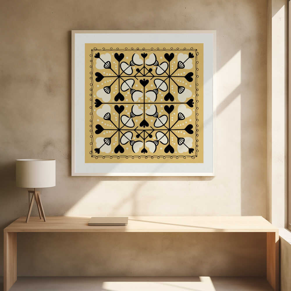 A framed square art print with a symmetrical folk art pattern on a mustard yellow background. The intricate black and white design features repeating heart and floral-like motifs, enclosed by a hand-drawn looped border. Poster